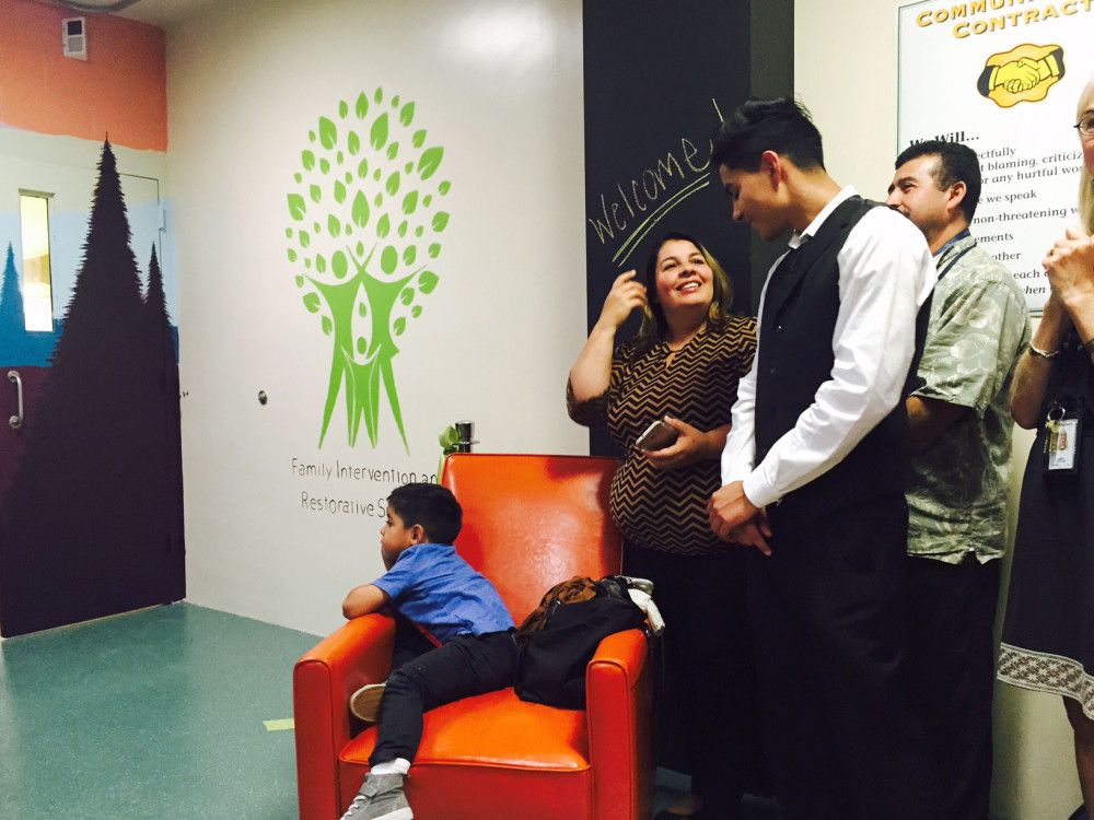 Image of Sergio Vera, 17, celebrating the opening of the FIRS Center