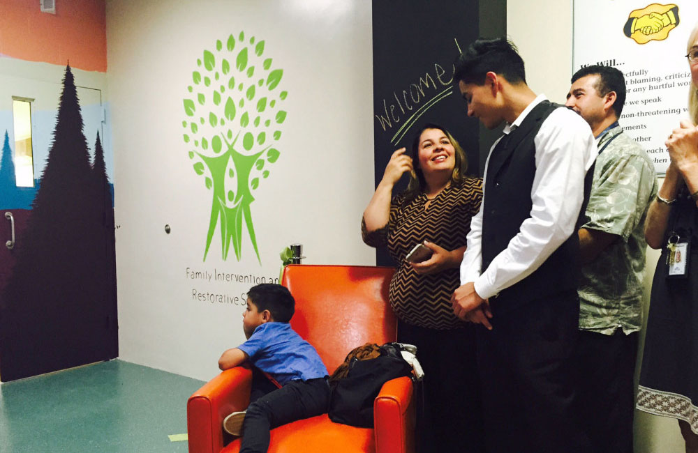 Image of Sergio Vera, 17, celebrating the opening of the FIRS Center