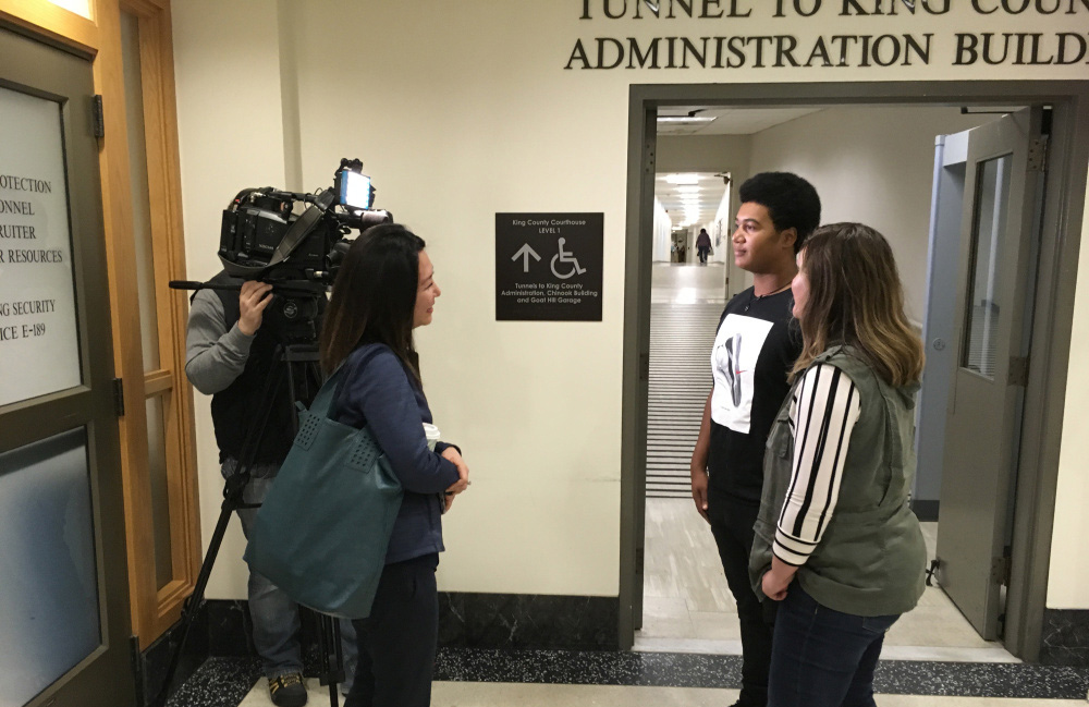 Image of Q13 crewmembers interviewing 17-year-old Delontea Sallee and his mom, Amanda
